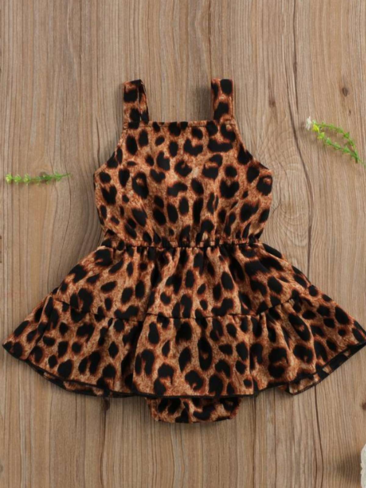 Baby romper dress with leopard print and front snap closure