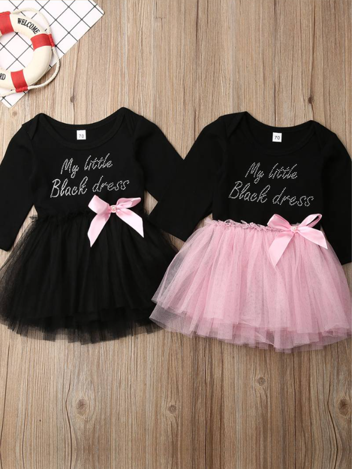 tutu dress has a long sleeved black bodice with "My Little Black Dress" in rhinestones and a tutu skirt