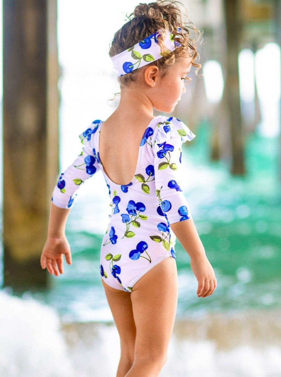 One-piece swimsuit with swoop back, ruffle shoulders, blue cherry print and matching headband 3T/4T to 8Y for toddlers and girls