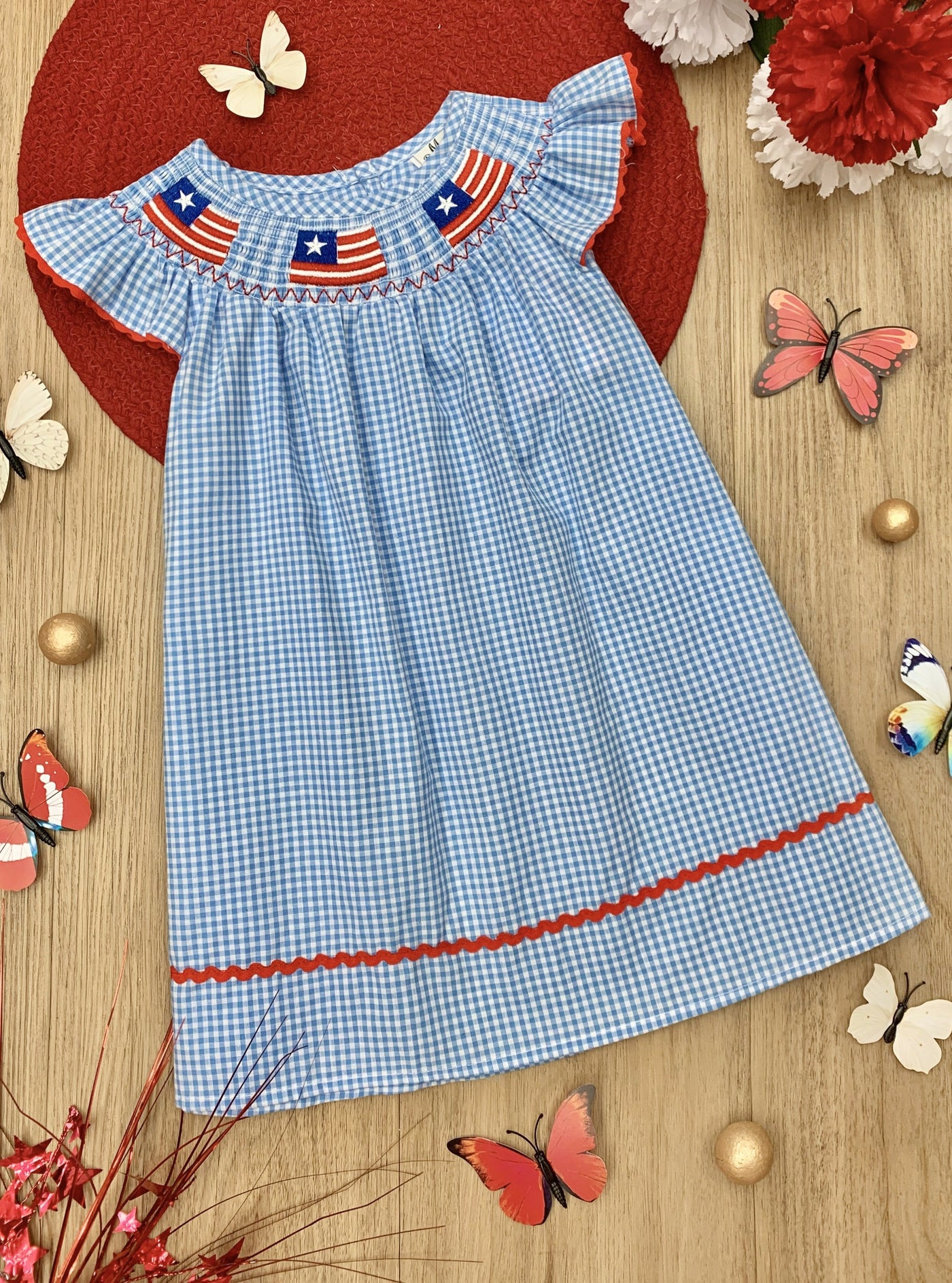 Girls dress features little flag appliques at the neckline with a red strip at the hem and flutter sleeve trim 2T-10Y for toddlers and girls 