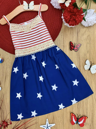 Girls 4th of July dress features a sleeveless red/white striped bodice with crochet details and blue/white star print skirt 2T-10Y for toddlers and girls