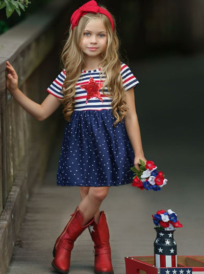 Girls dress features a red/white/blue striped bodice and a red sequin star and blue/white starred skirt