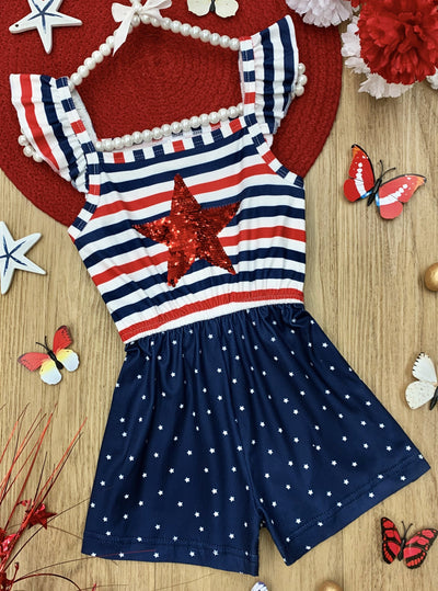 Girls romper features a white, blue, and red striped bodice with red sequin star and flutter sleeves, and blue shorts with white polka dots 2T-10Y for toddlers and girls