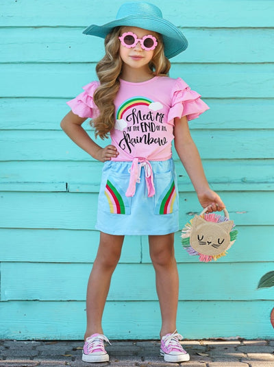 Girls set features a pink knot hem top with multi-layer ruffled sleeves and "Meet me at the end of the rainbow" graphic print and a blue skirt with built-in drawstrings and rainbow front pockets