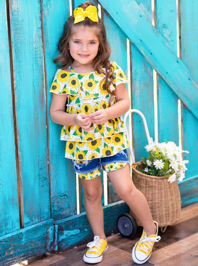 girls set features a white top multi-layer top with off-shoulder sleeves and sunflower print and denim shorts with sunflower patches