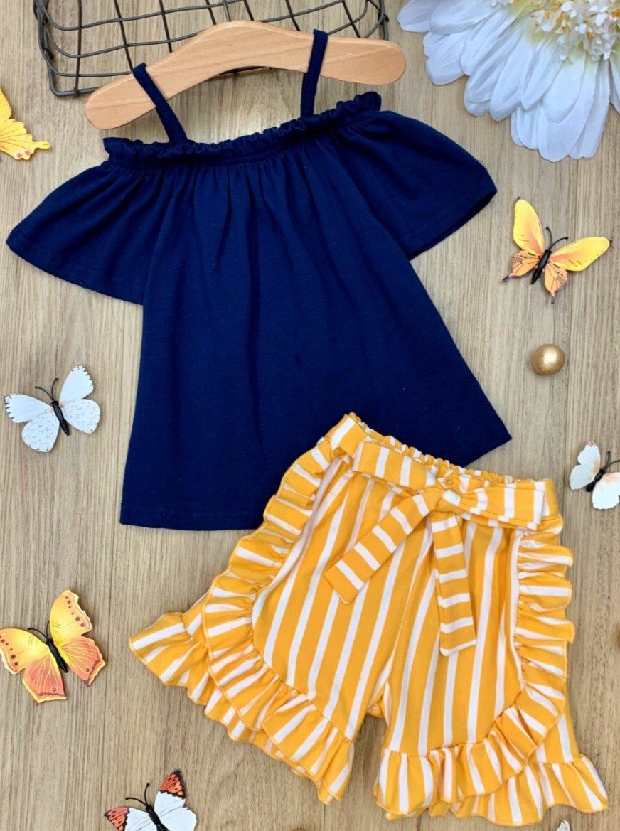 Girls set features an off the shoulder navy top with striped white yellow ruffled shorts with a sash