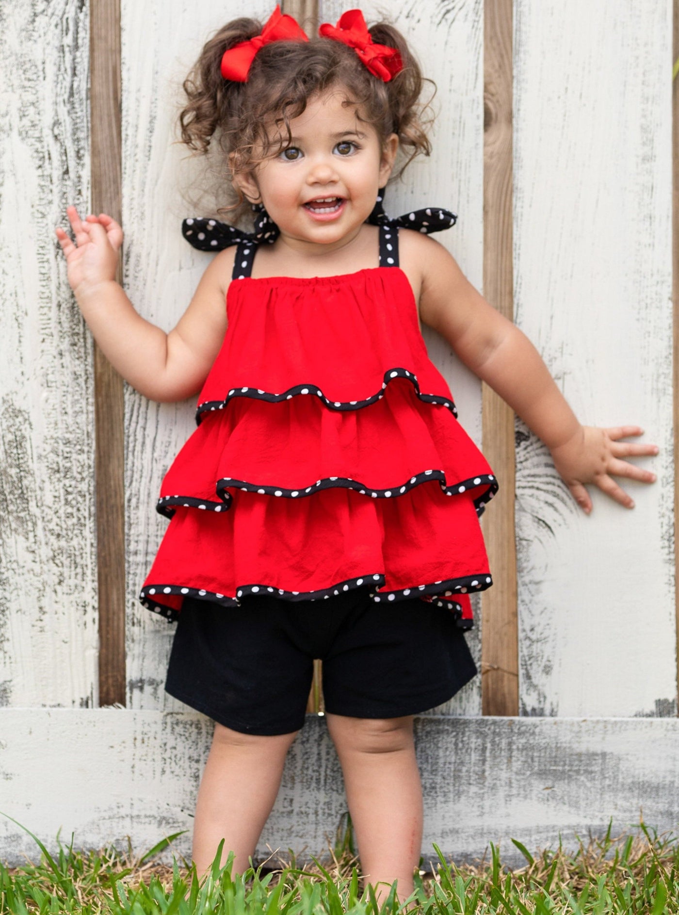 Girls set features a red top polka dot bow straps and three-tier ruffle hem and black shorts with stretchy waistband 2T -10Y