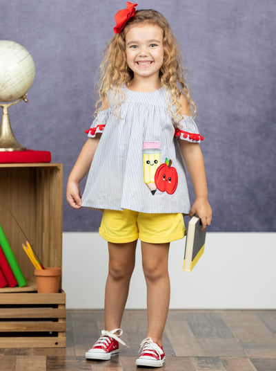 Girls set features a top with apple applique with pompom details with shorts and pompom details
