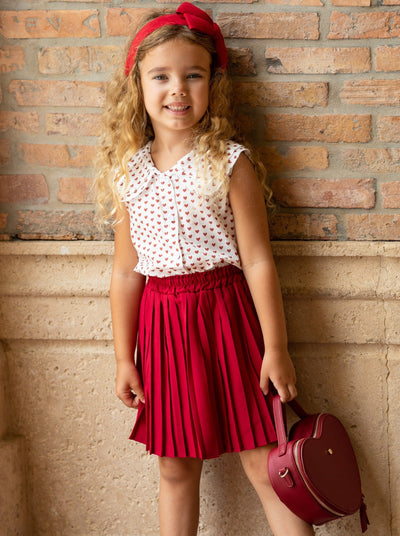 Girls set features a top with a cute collar and heart prints and red pleated skirt