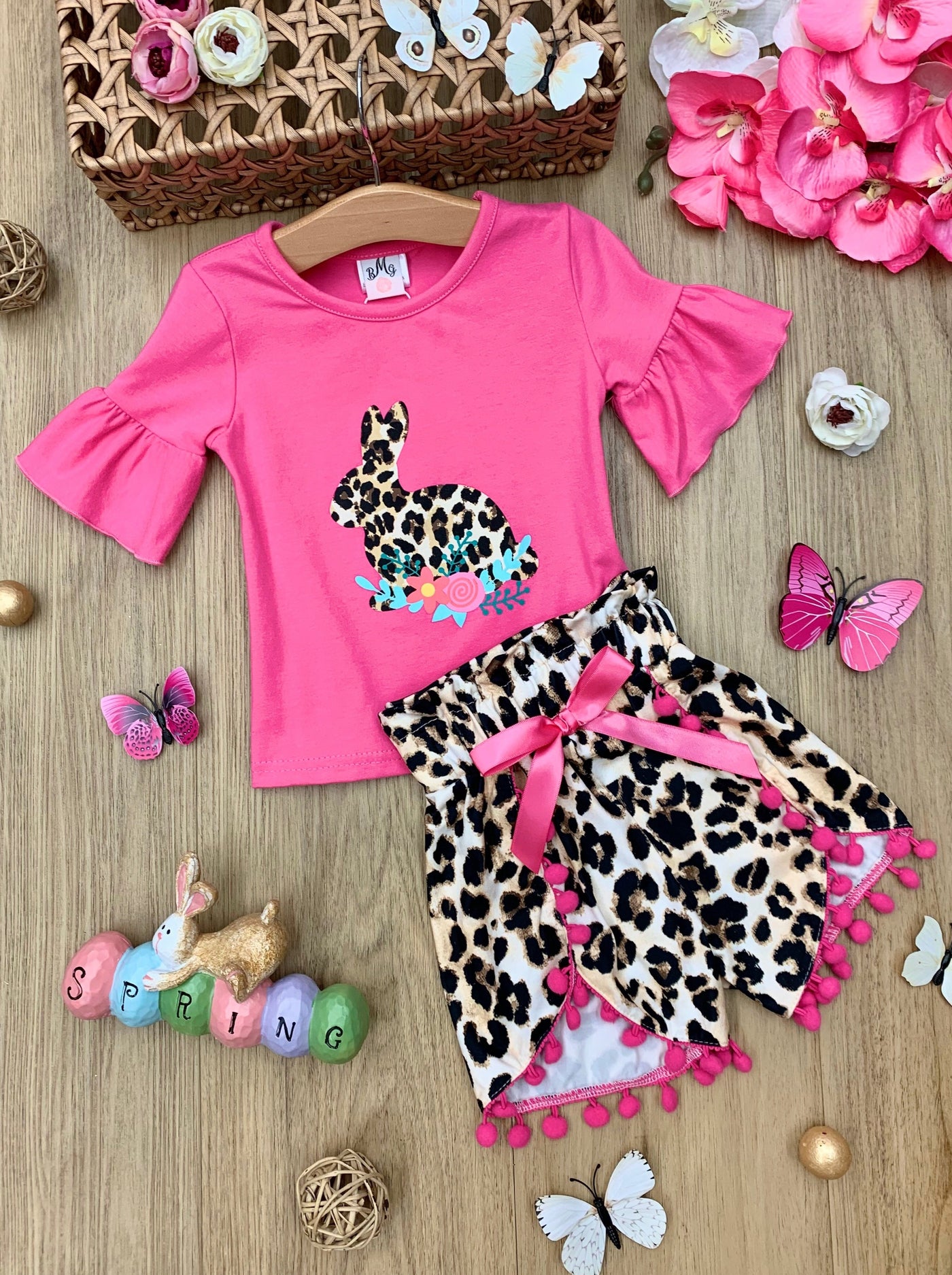 Easter set features hot pink top with short ruffle sleeves and leopard print bunny graphics and matching leopard print shorts with hot pink drawstring and tassels for 2T to 10Y for toddlers and girls