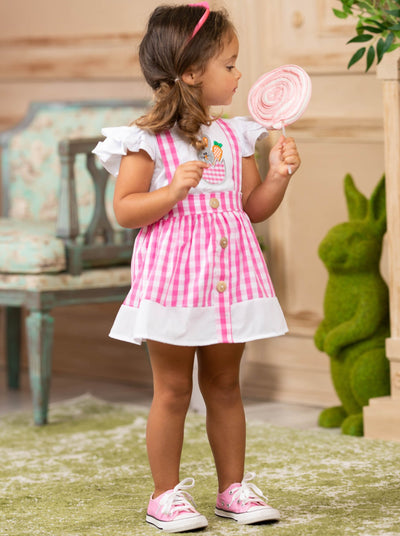 girls spring set features a white top with ruffle sleeves and bunny applique and a plaid skirt with suspenders and faux buttons and a white hem 2T to 10Y