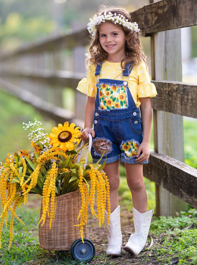 Girls Summer set features a yellow ruffle sleeve top with white polka dots and denim overall shorts with sunflower print and sequin mesh patches - 2T-10Y