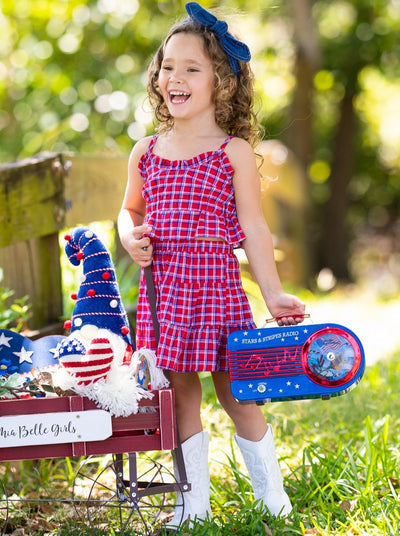 Set features a red/blue Gingham print ruffled crop top with spaghetti straps and a matching skirt