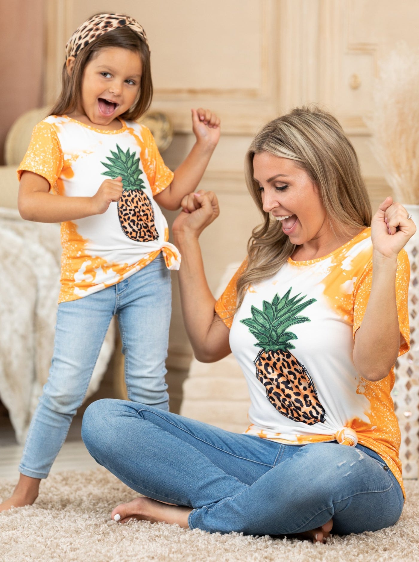 Mother-daughter top features tie-dye sleeves, back, and hem with a leopard print pineapple graphic design - 12MON-8Y for toddlers and girls and S to XL for Moms
