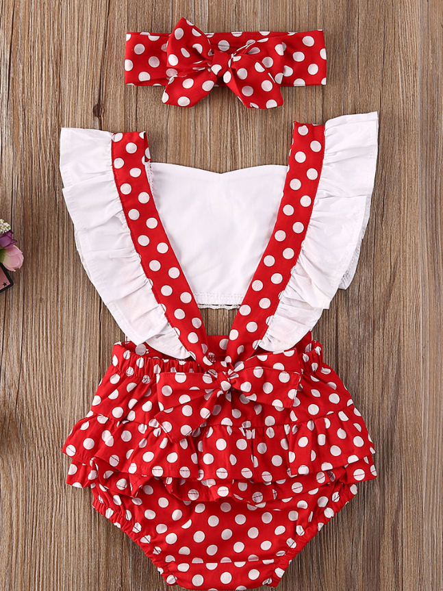 Baby overall style onesie with ruffles on the bum that ties in the back and a matching headband Red