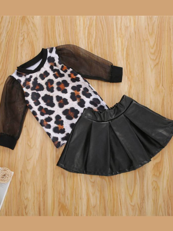Girls set features a top with leopard print and long tulle black sleeves, comes with a vegan leather skirt