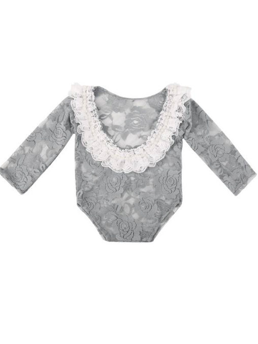 Baby lace onesie has an open back with white lace ruffles  grey