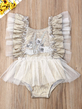 Baby ruffled tutu onesie has a cute flower applique and is a pullover style taupe
