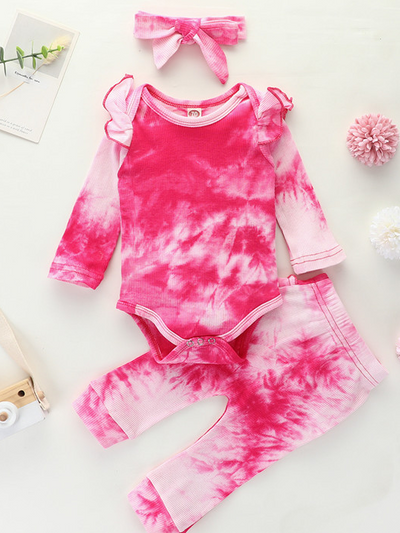 Baby set features a tie-dye long-sleeved onesie with ruffled shoulders, ruffled leggings, and matching headbands