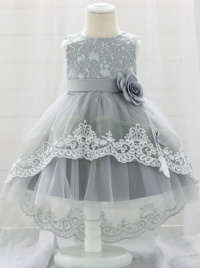 Baby dress has embroidered tulle overlay bodice and hi-lo tulle overlay skirt, removable big bow accent at the back and flower applique at the front