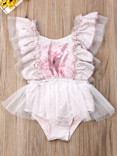 Baby ruffled tutu onesie has a cute flower applique and is a pullover style pink