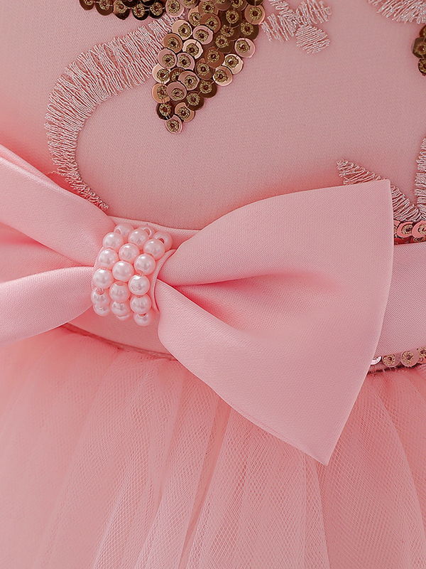 Baby princess dress has a satin bodice with sequin applique, a bow belt at the waist, and a layered tulle skirt 