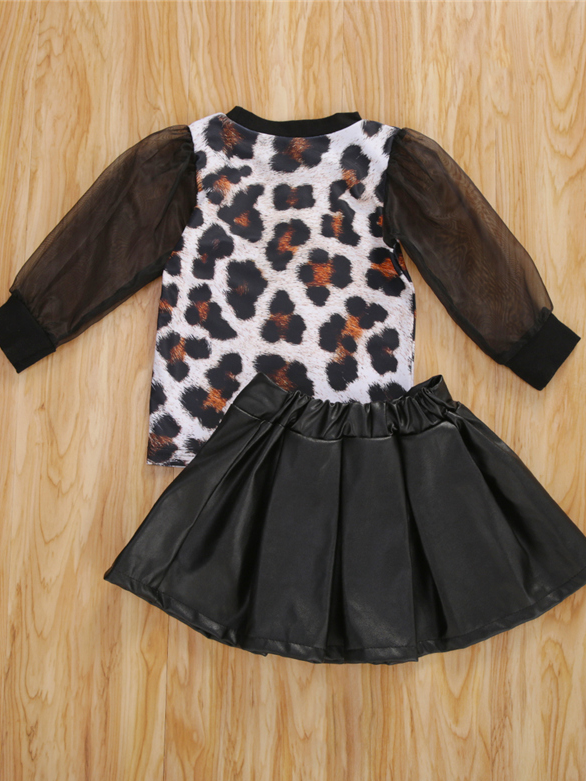 Girls set features a top with leopard print and long tulle black sleeves, comes with a vegan leather skirt