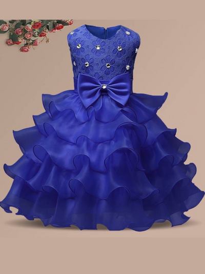 Baby princess dress has a floral lace bodice with rhinestone details, a bow belt at the waist, and a multi-layered tulle skirt