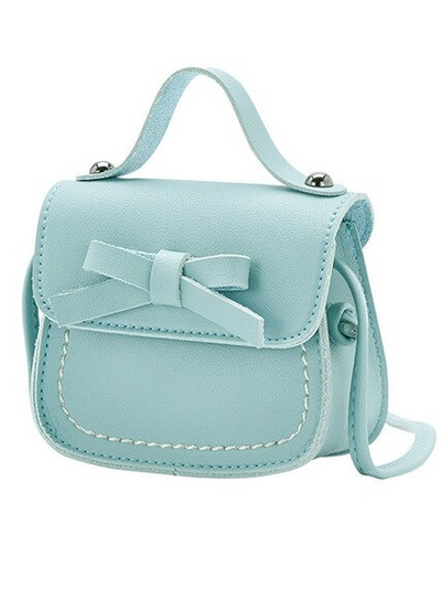 Girl with crossbody handbag with little bow light blue