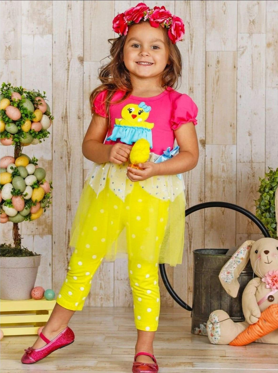 Girls Spring Easter-themed set features ruffle sleeves, chick applique, and two-tier sequin tulle hem with stretchy polka dot capris-length leggings for 2T to 10Y toddlers and girls