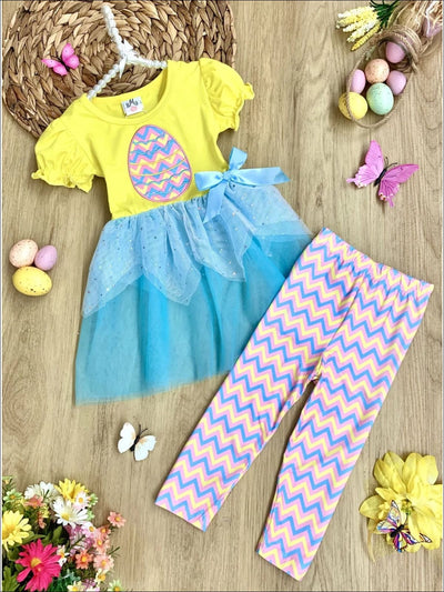 Girls Easter-theme set features ruffle short sleeves, egg applique, and two-tier sequin tulle hem with stretchy zigzag striped capris-length leggings for 2T to 10Y for toddlers and girls