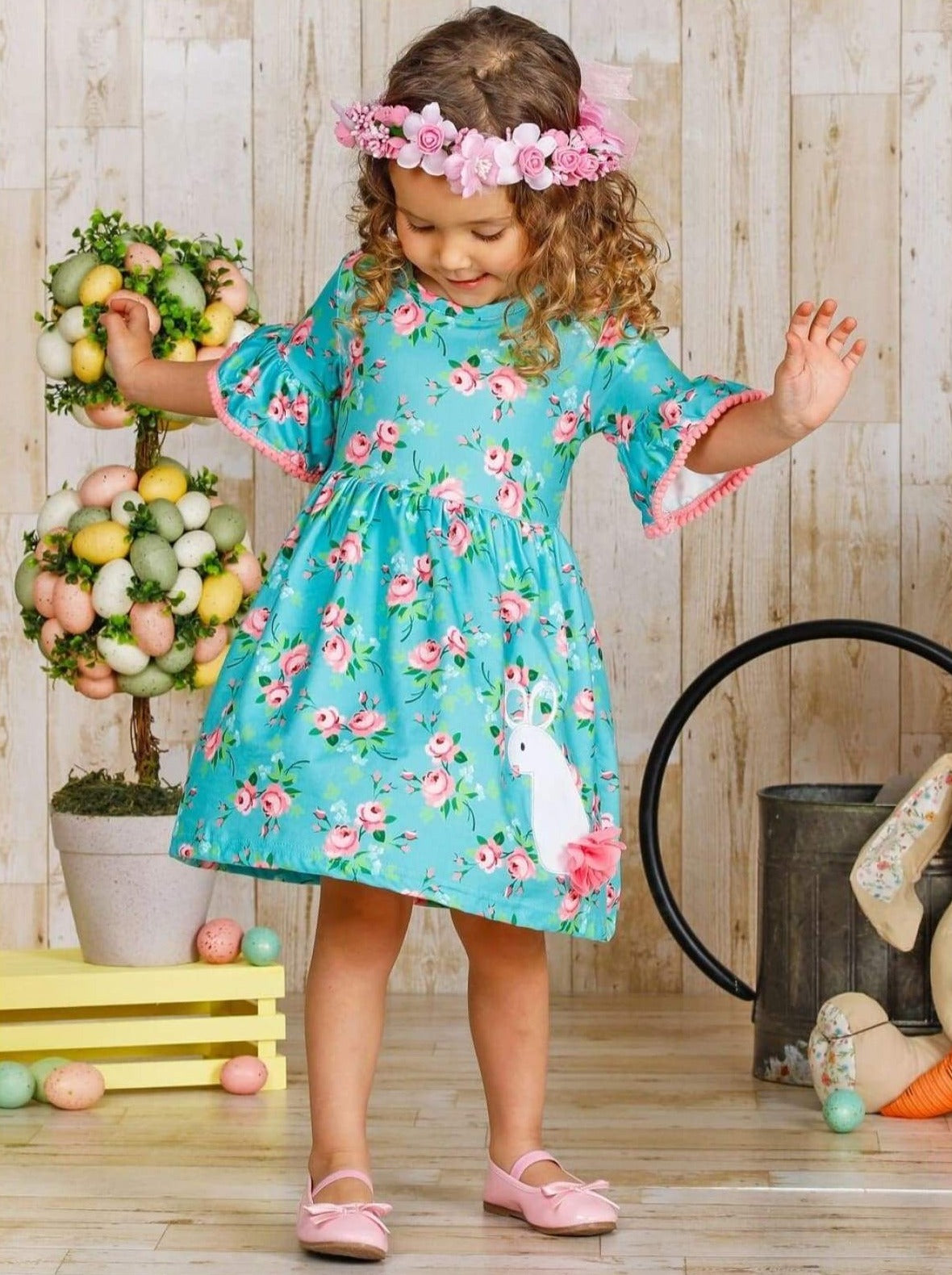 Dress features a floral print, pom-pom trim ruffle sleeves, and a bunny tail applique- Girls Spring Casual Dress 2T/8Y