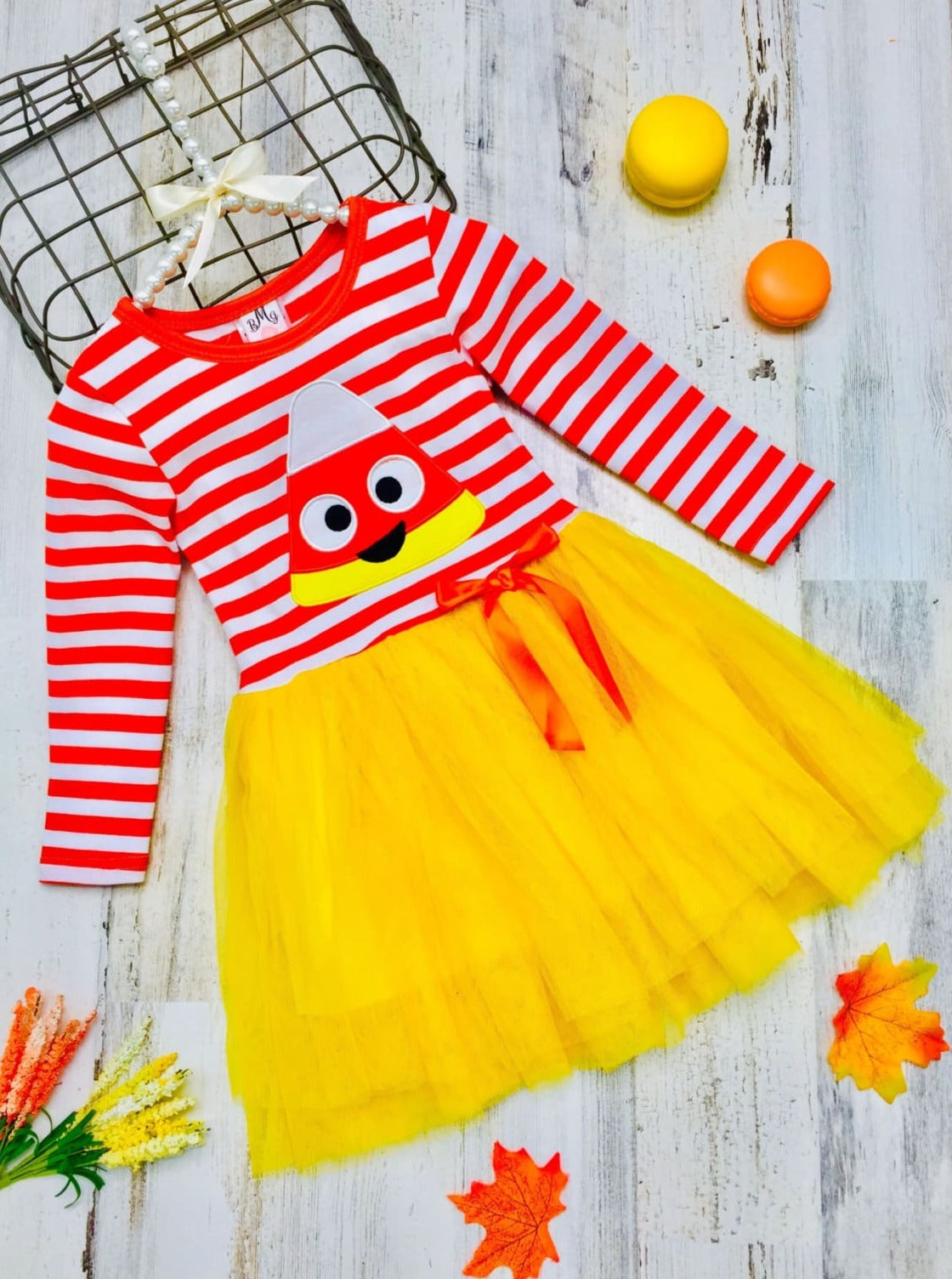Little girls Halloween long-sleeve tutu dress with striped print bodice, candy corn applique, and gathered tulle skirt embellished with a ribbon bow - Mia Belle Girls