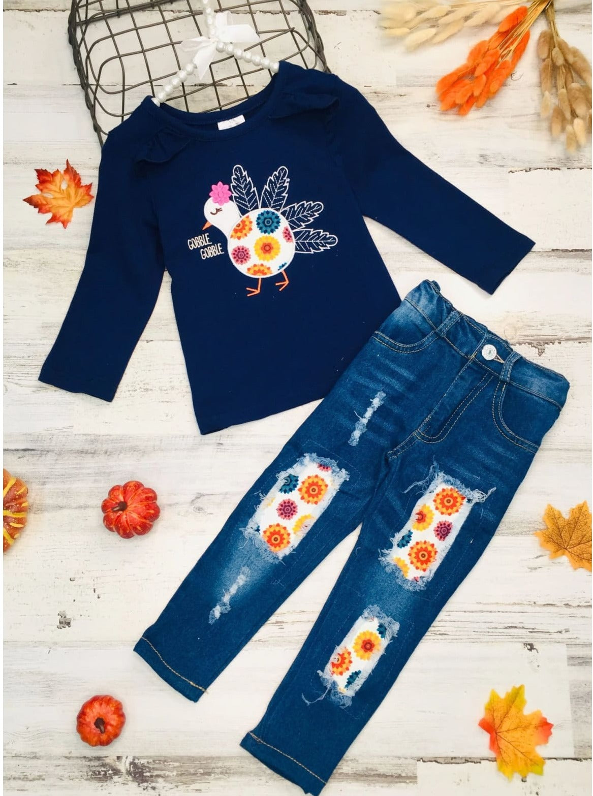 Little girls Thanksgiving long-sleeve top with ruffle shoulder accents, "Gobble Gobble" floral turkey graphic, and matching patched jeans - Mia Belle Girls