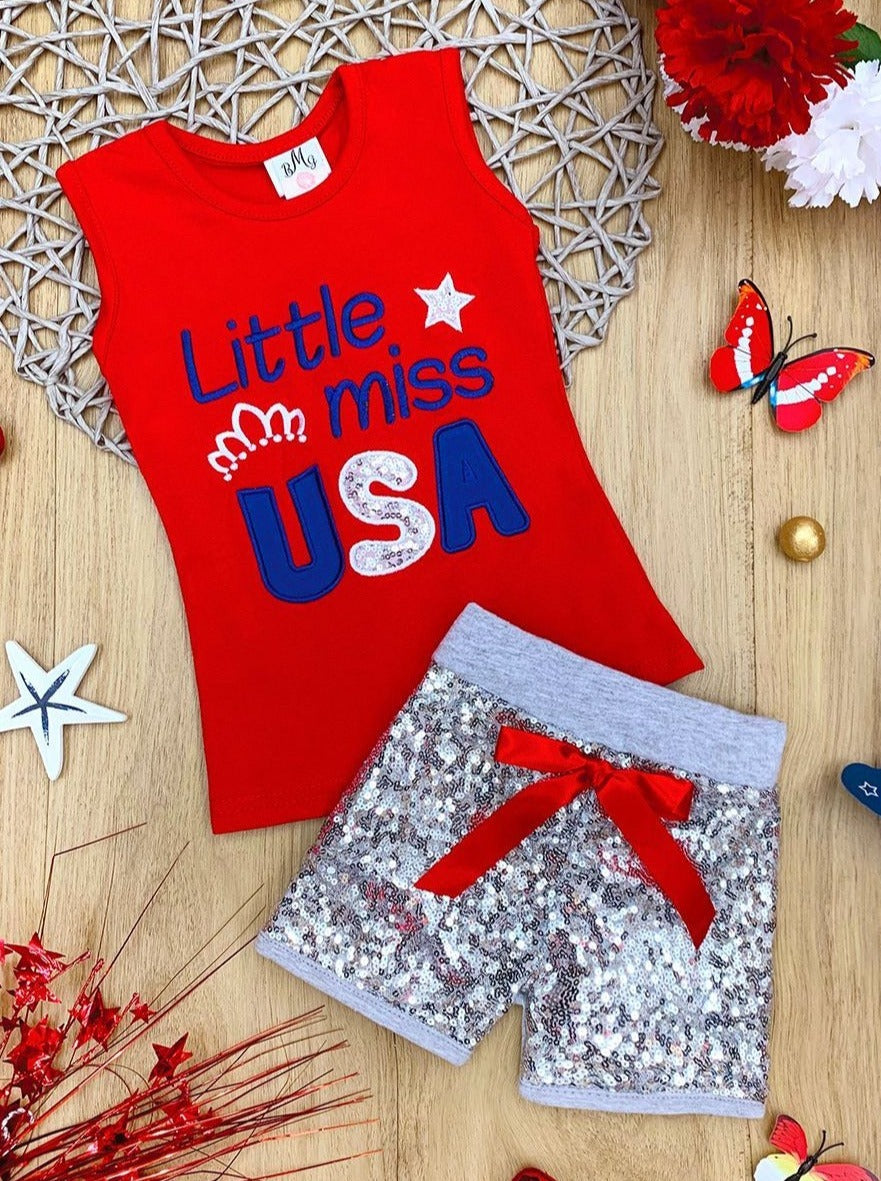 The set features a red top with a "Little Miss USA" graphic and silver sequin shorts and a red sash